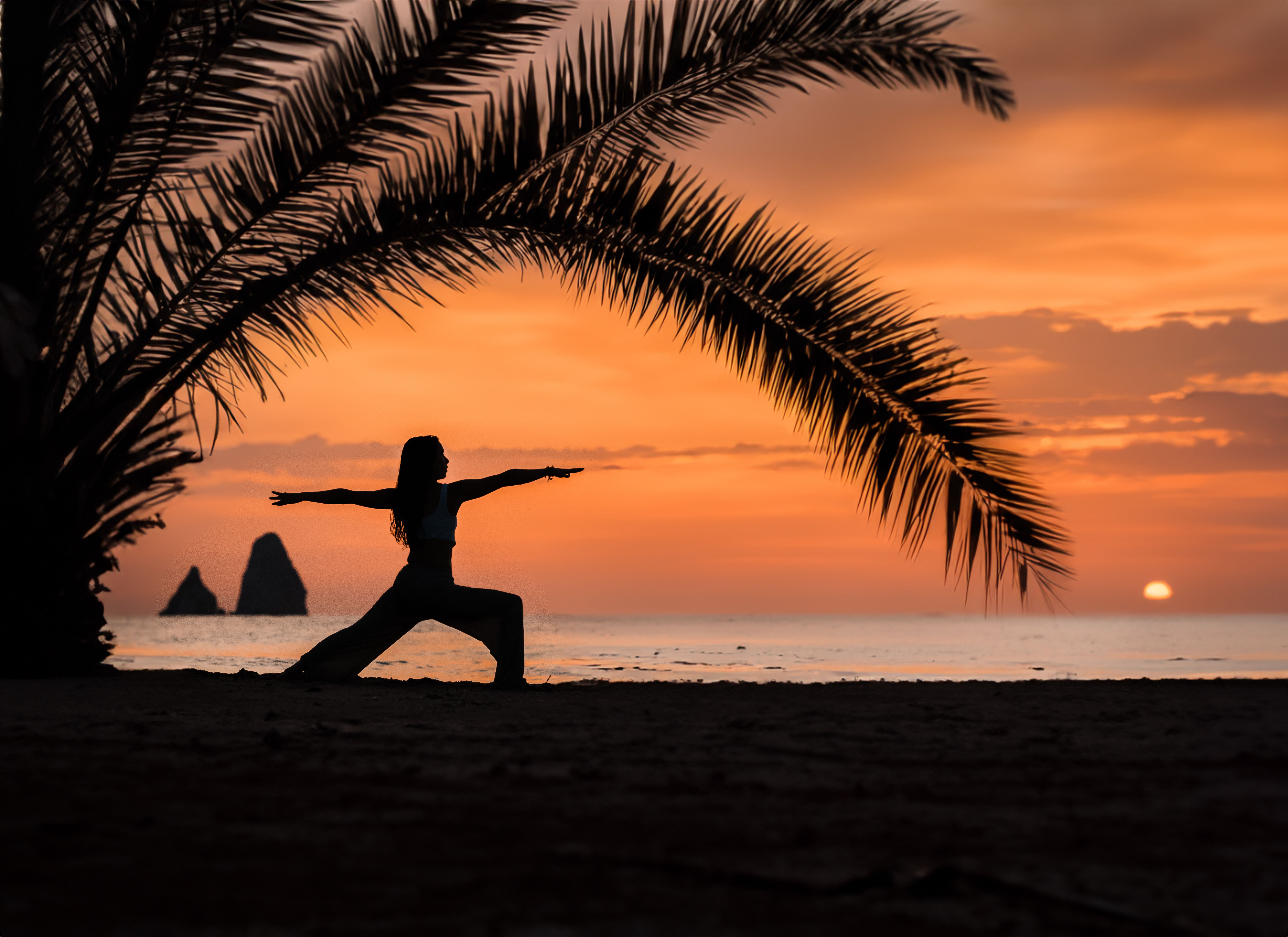 Yoga class on the beach at sunrise